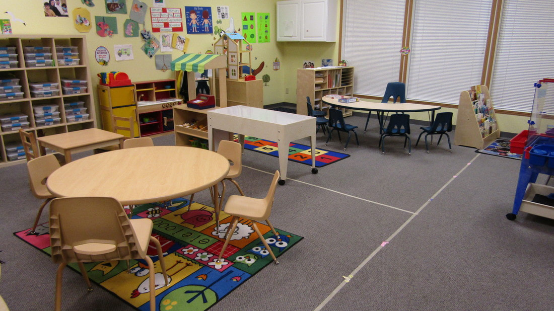 Classroom with child-sized tables and learning materials